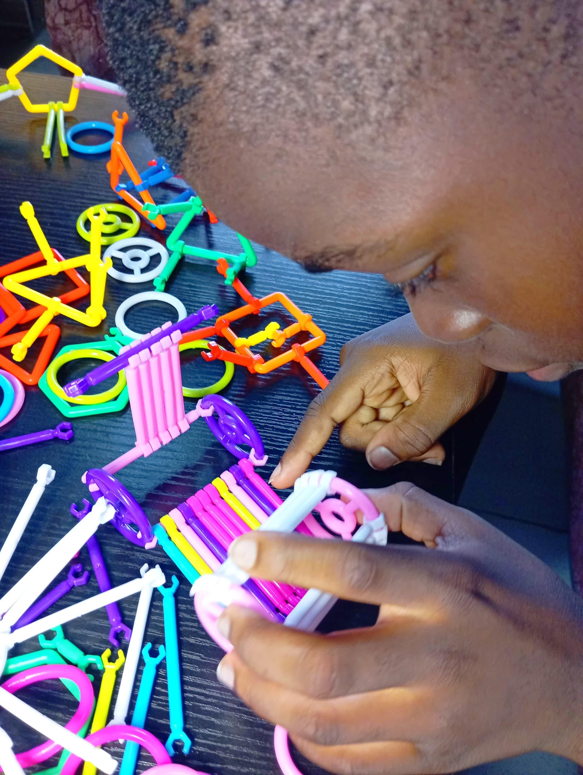 A Hill Rays pupil absorbed in a hands-on activity