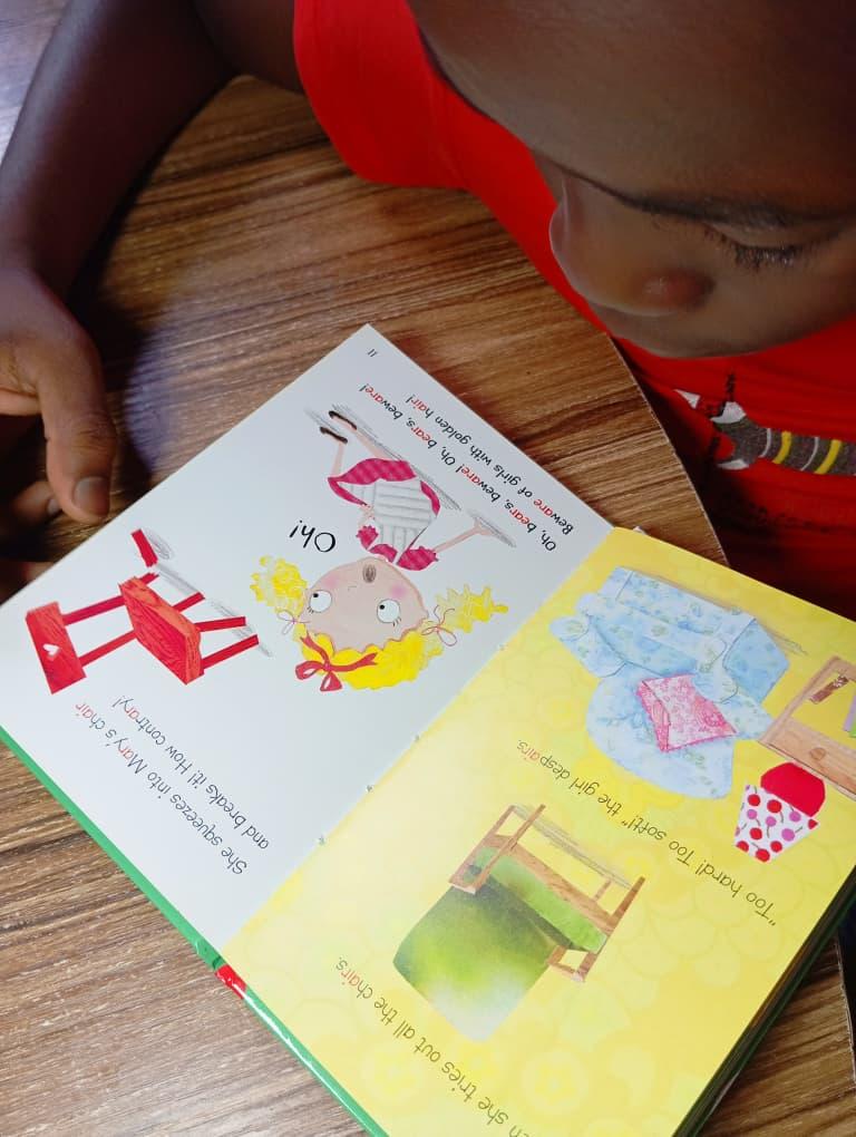 A young learner focused on a hands-on building activity